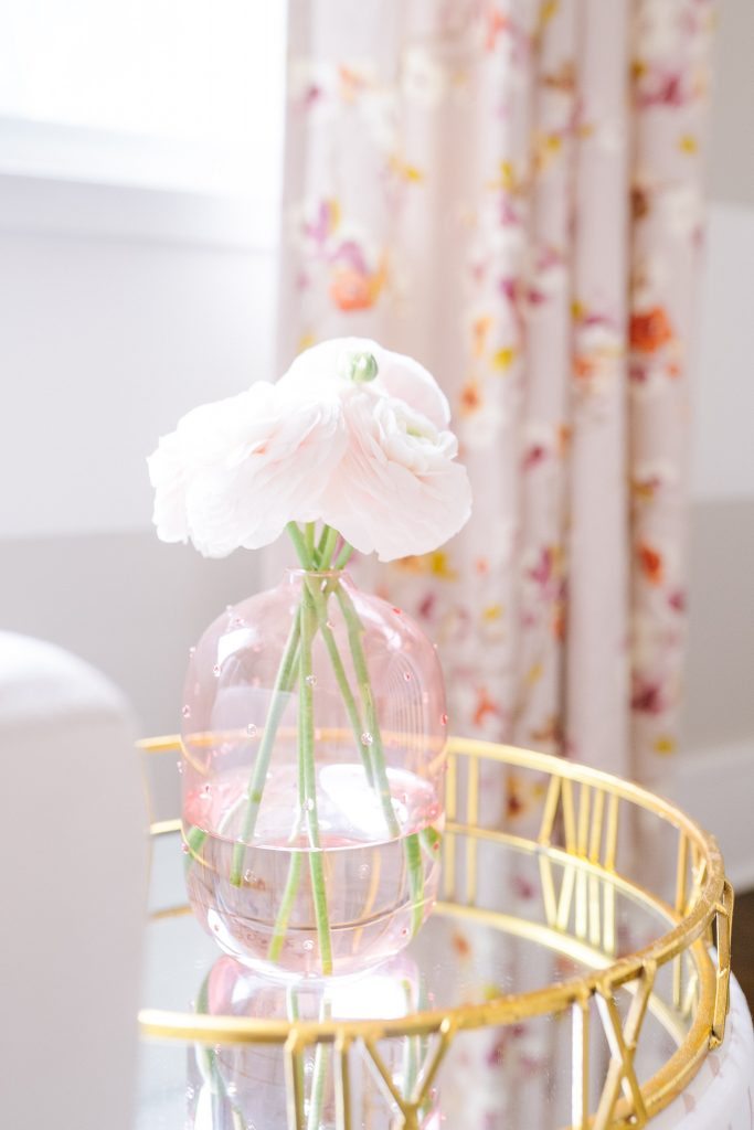 ranunculus in pink glass vase 